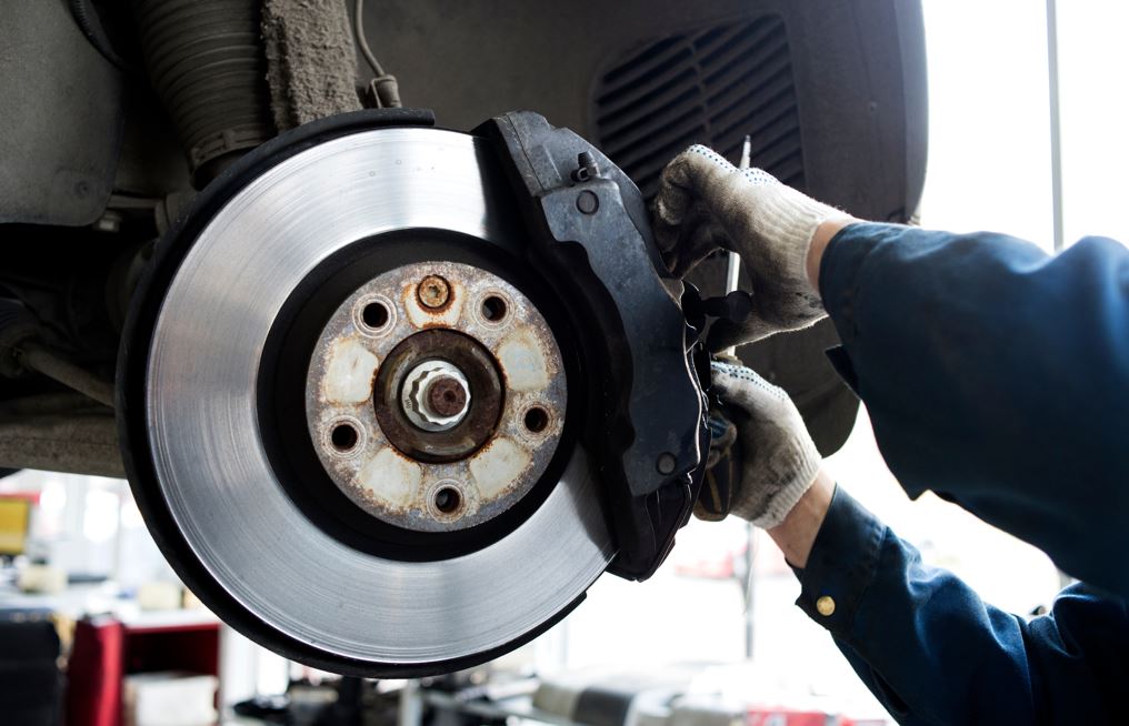 A technician working on brakes.