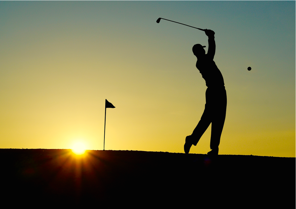 A silhouette golfing.